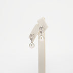 Pearl earrings on a white background