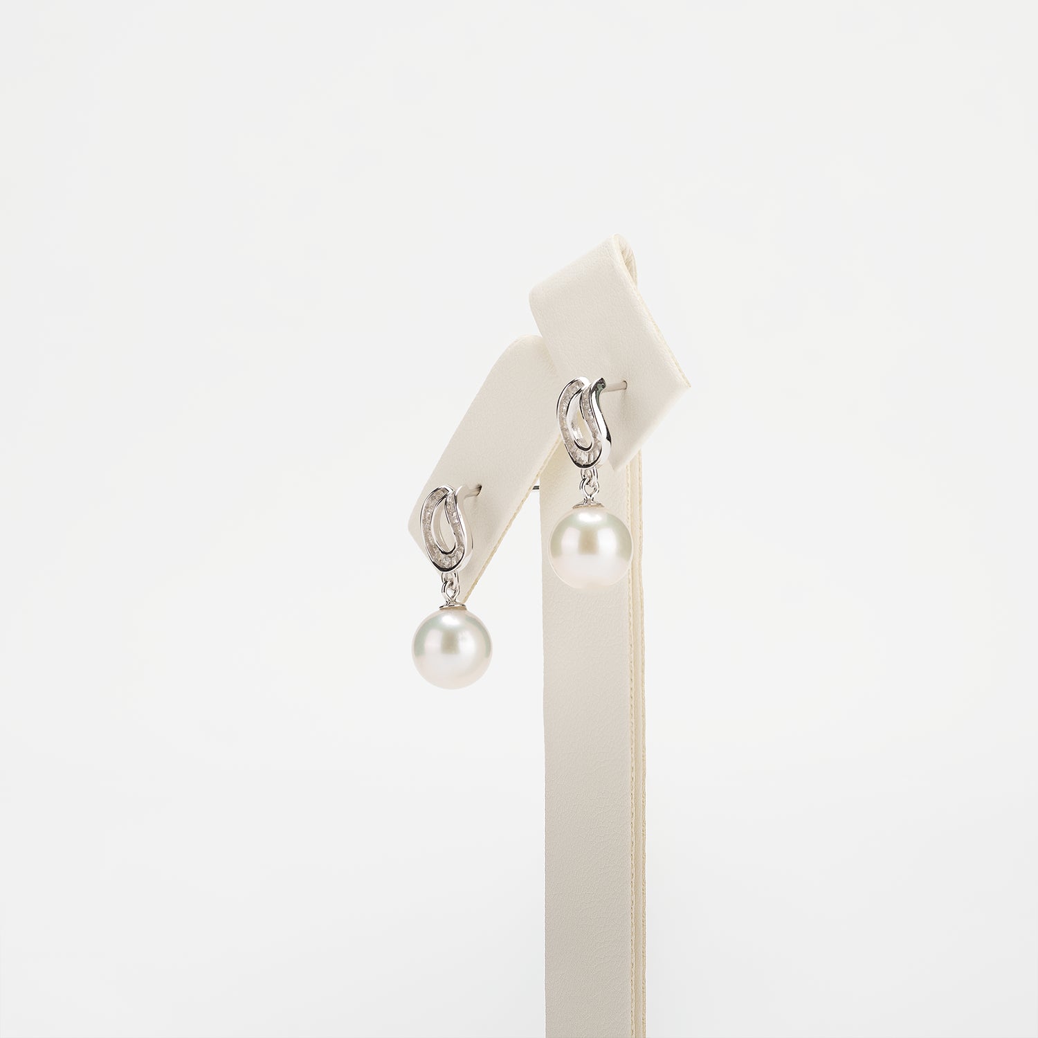 Pearl earrings on a white background