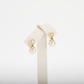 Pearl earrings on a white background