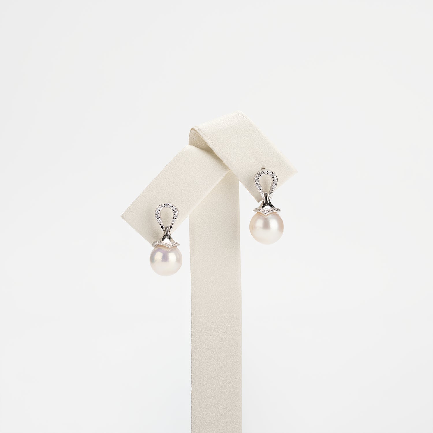 Pearl earrings on a white background