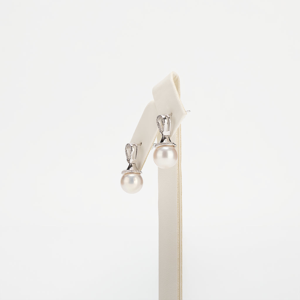 Pearl earrings on a white background