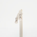 Pearl earrings on a white background