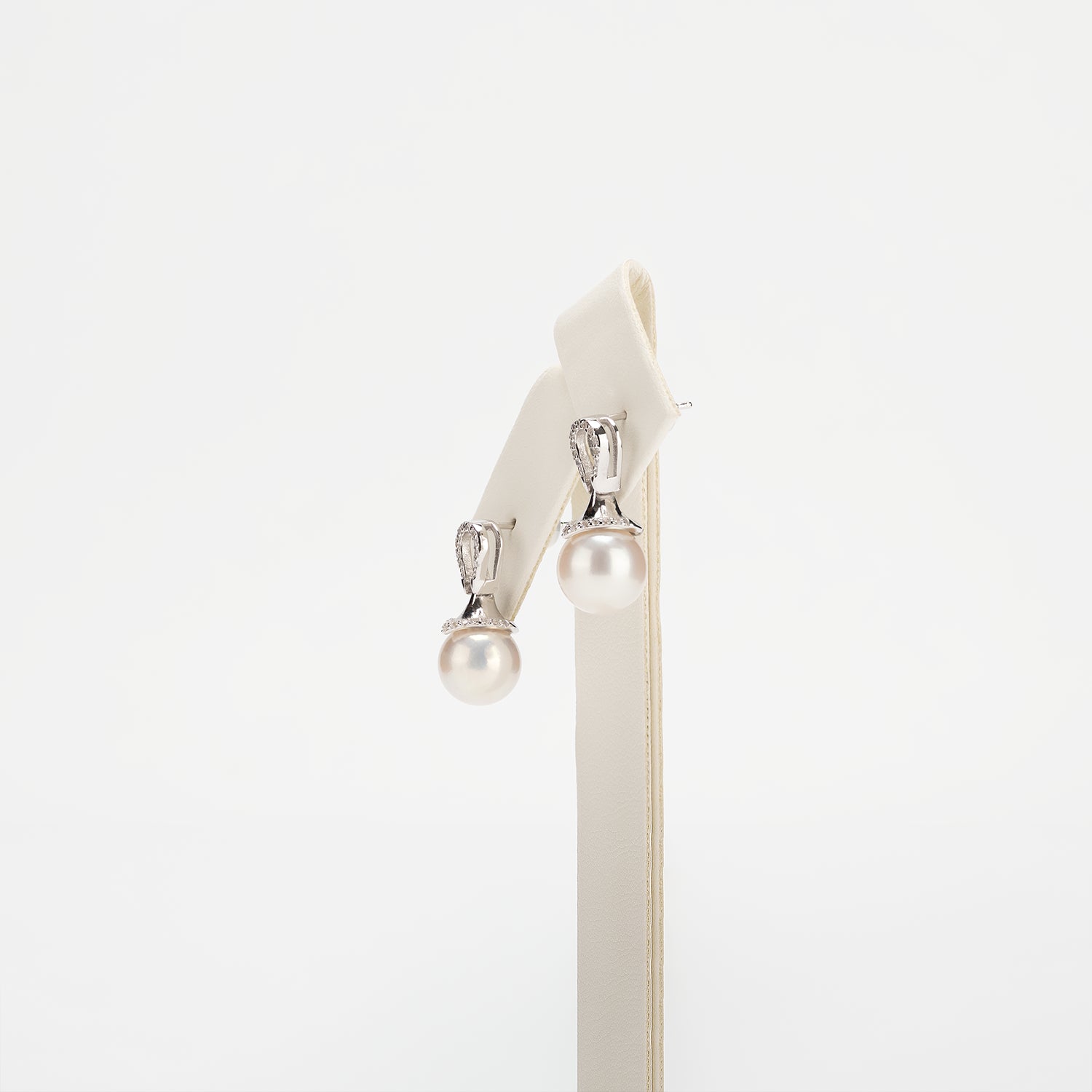 Pearl earrings on a white background