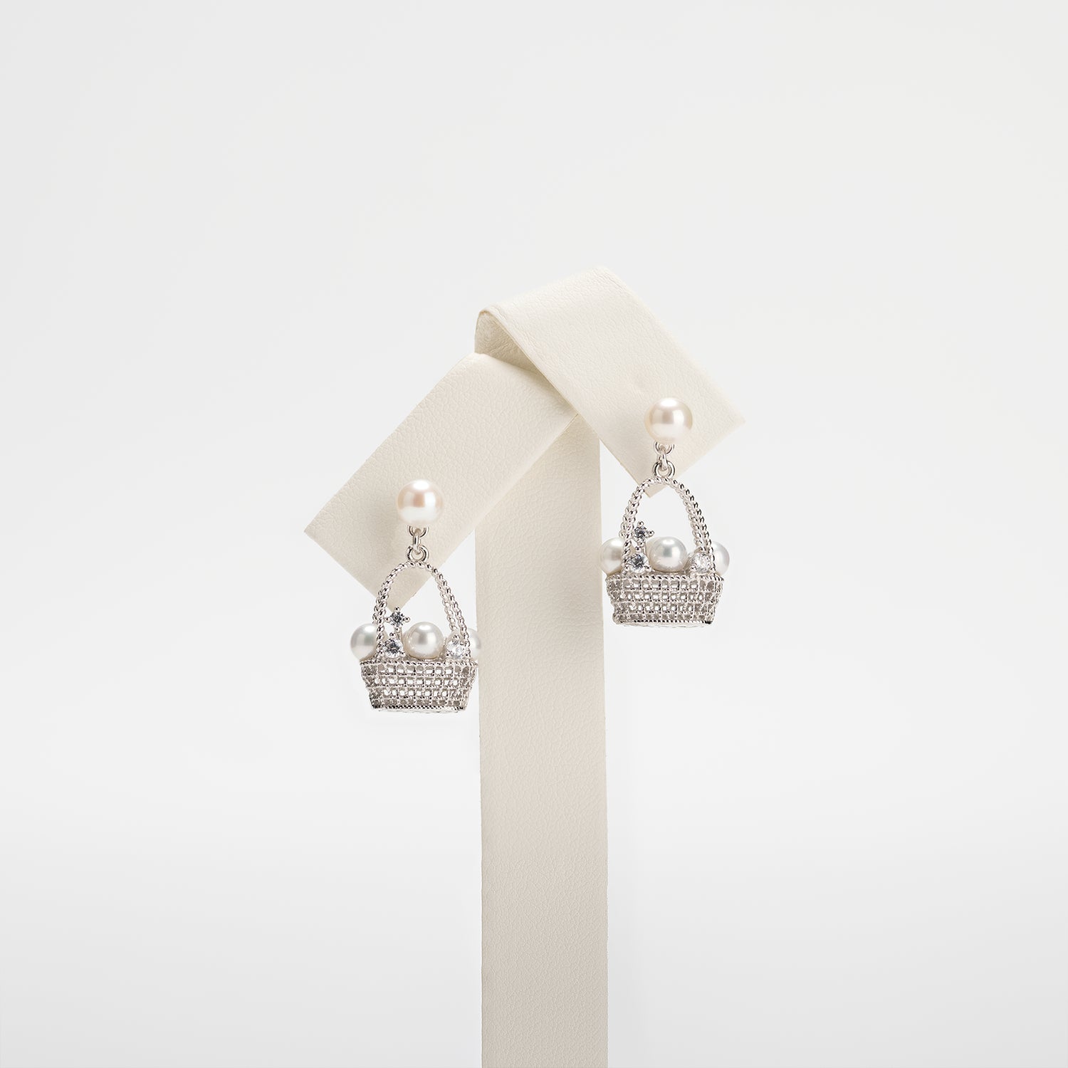 Pearl earrings on a white background