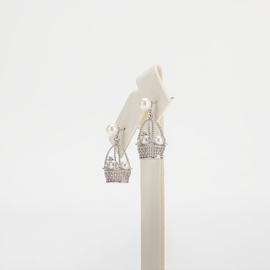 Pearl earrings on a white background