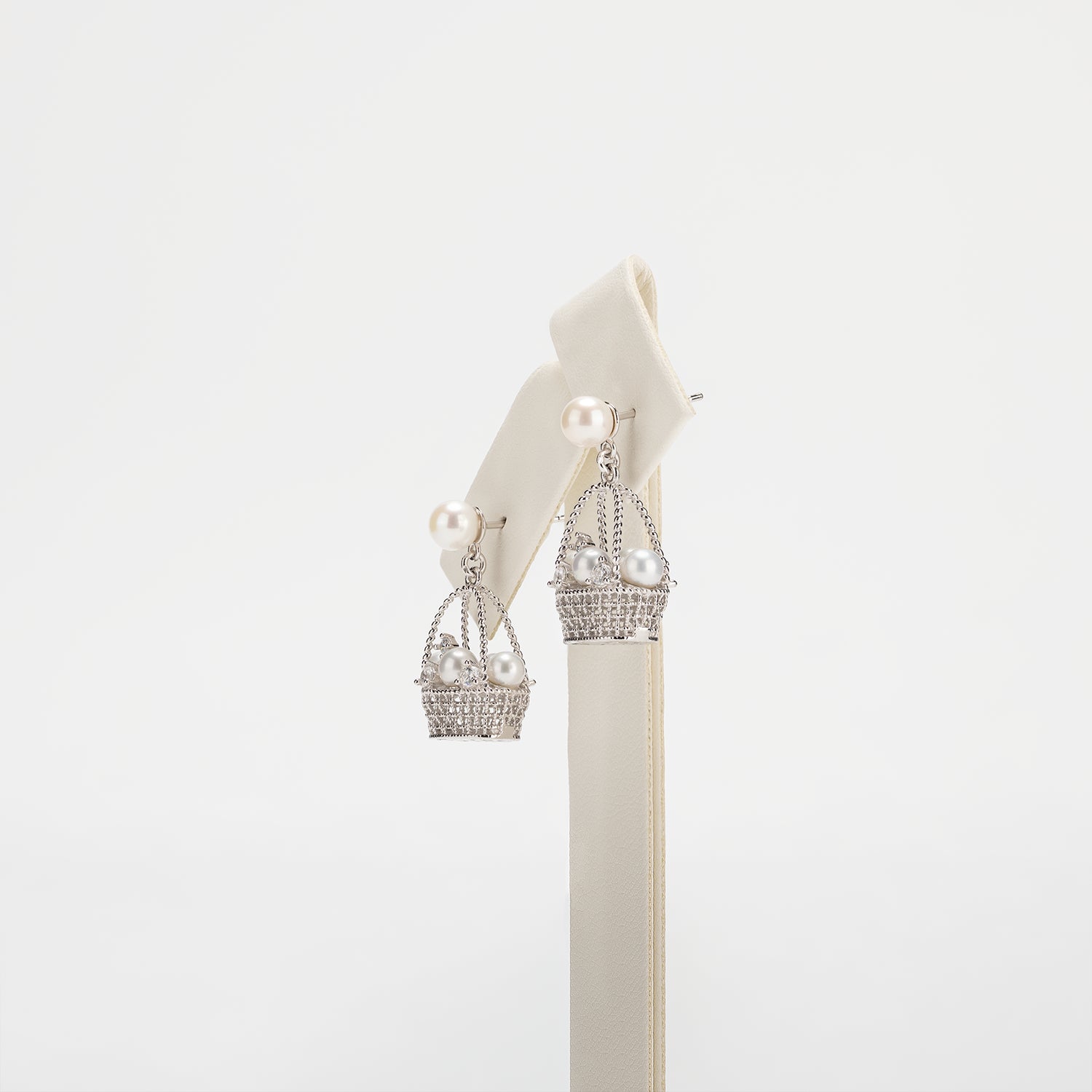 Pearl earrings on a white background