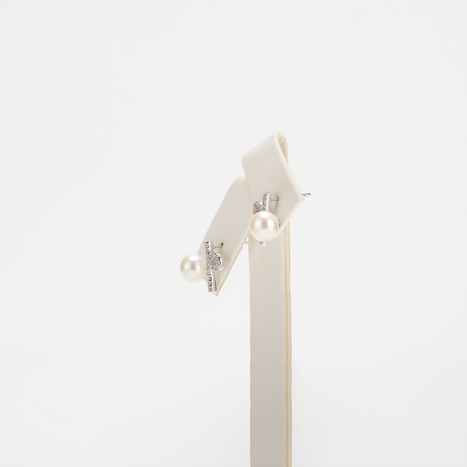 Pearl earrings on a white background