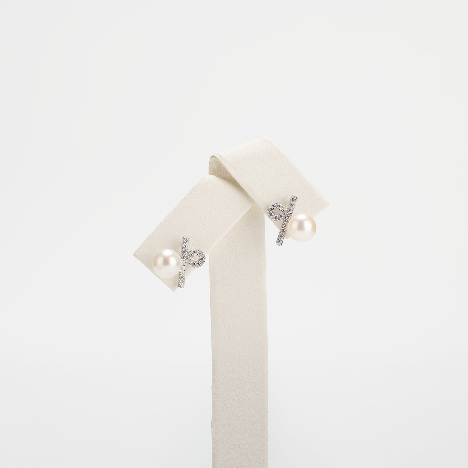 Pearl earrings on a white background
