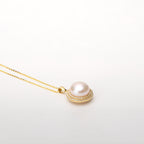 Pearl  pendant necklace on a white background