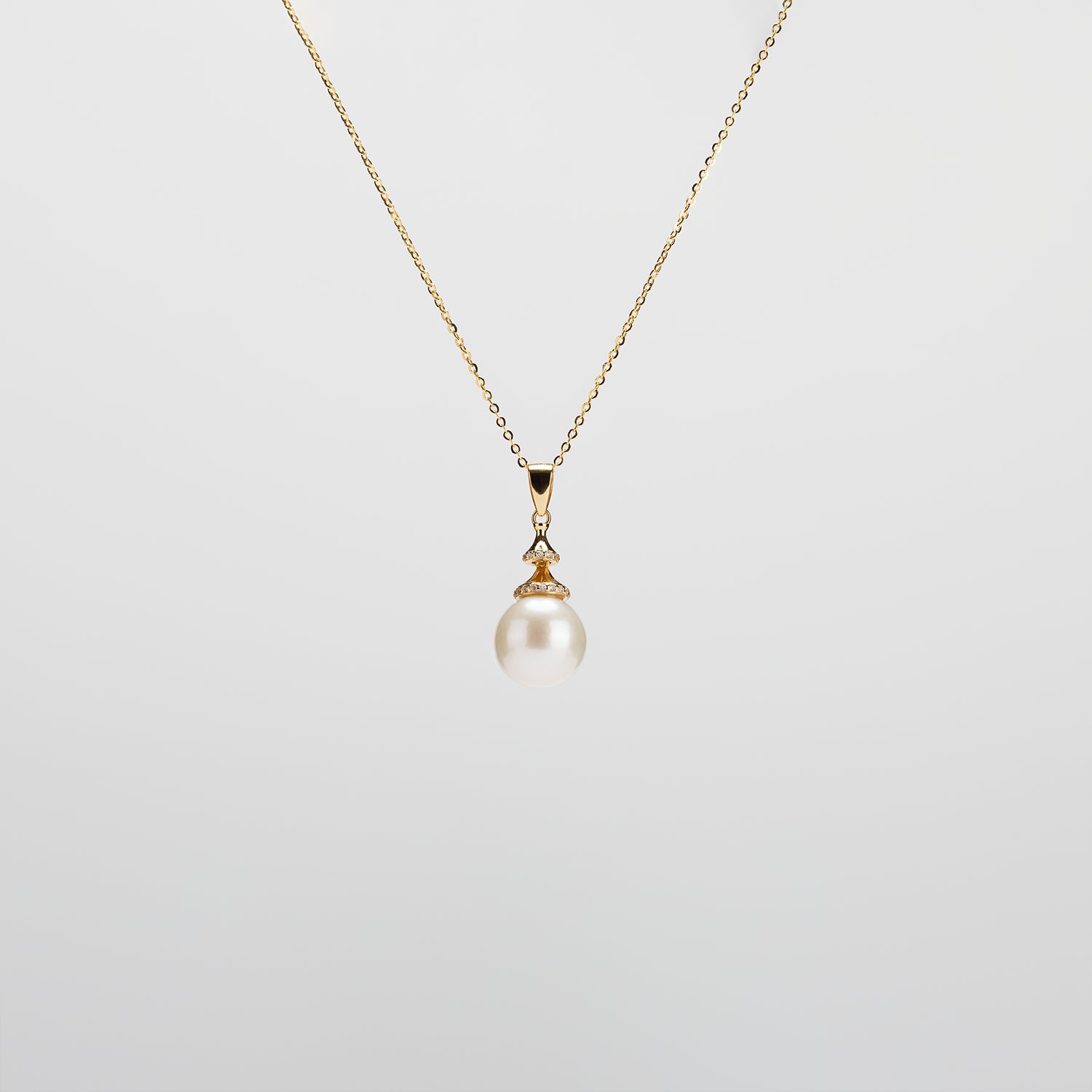 Pearl  pendant necklace on a white background