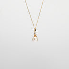 Pearl  pendant necklace on a white background