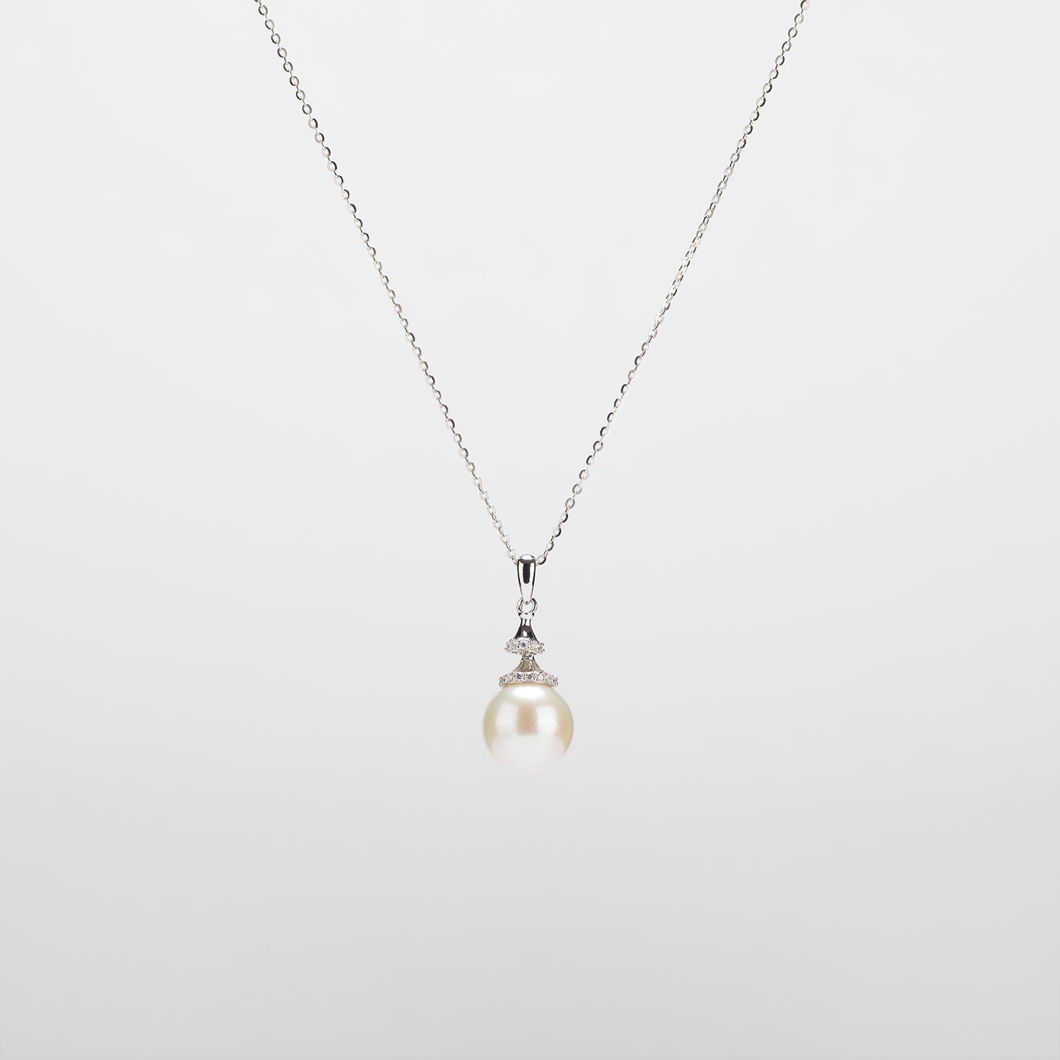 Pearl  pendant necklace on a white background