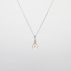 Pearl  pendant necklace on a white background