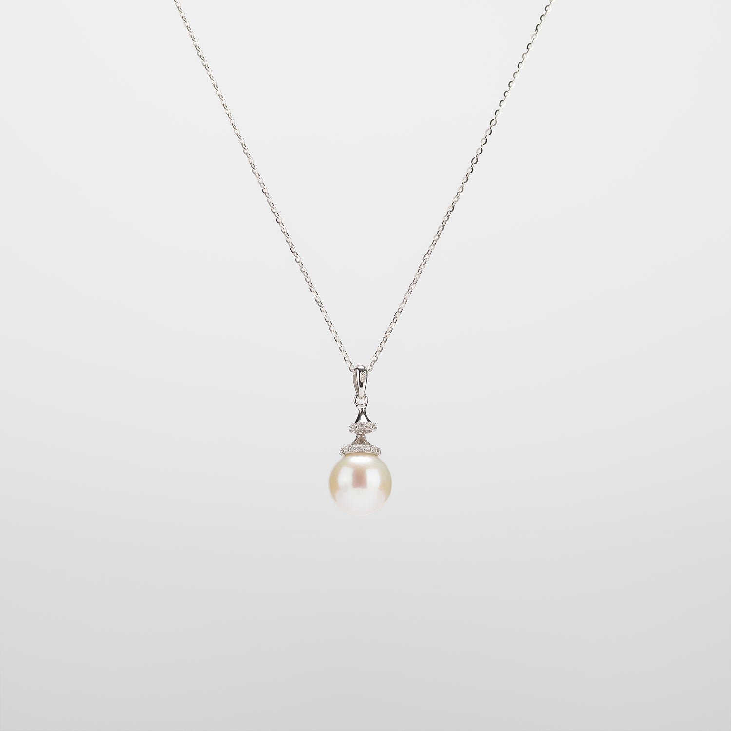 Pearl  pendant necklace on a white background