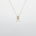 Pearl  pendant necklace on a white background