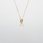 Pearl  pendant necklace on a white background