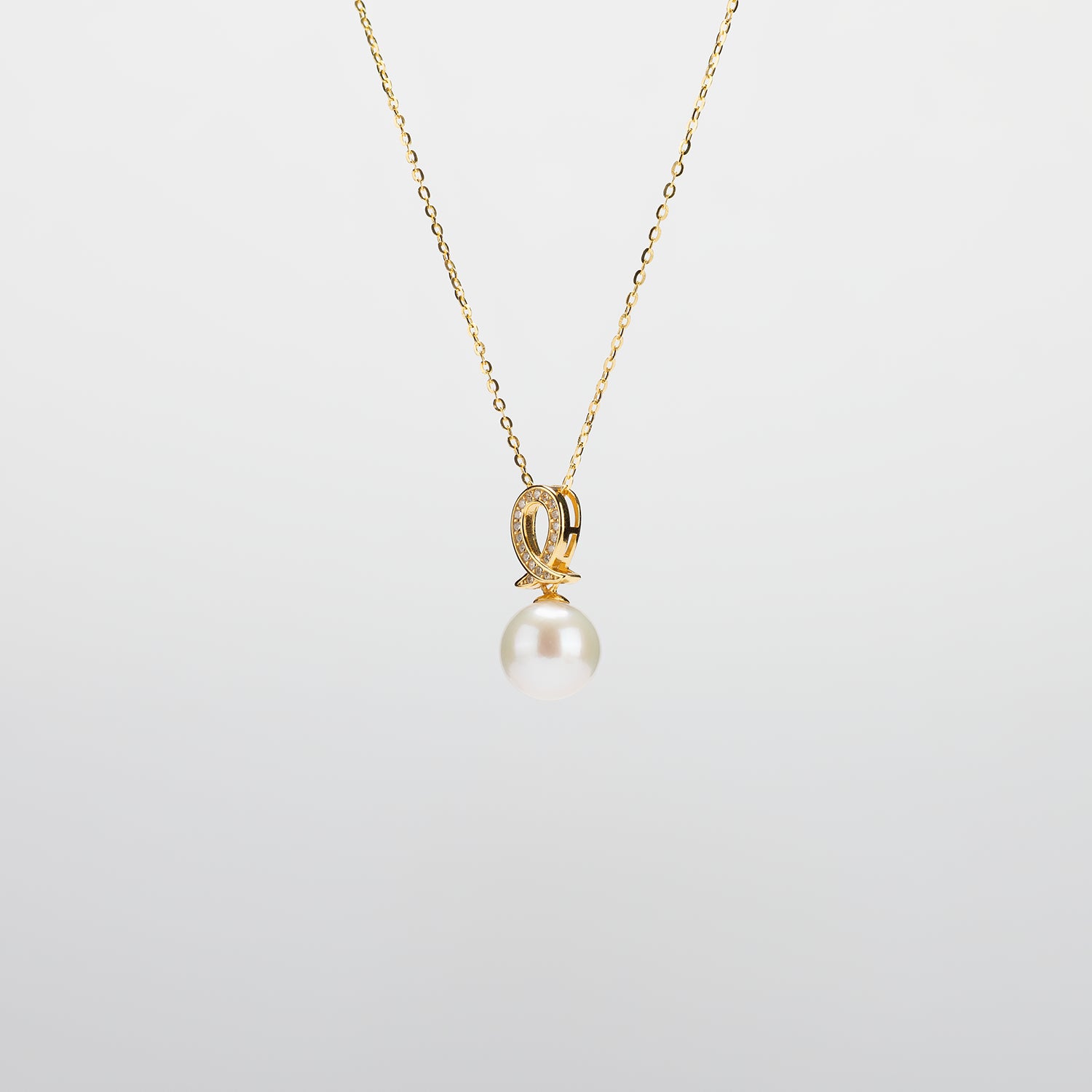 Pearl  pendant necklace on a white background