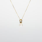 Pearl  pendant necklace on a white background