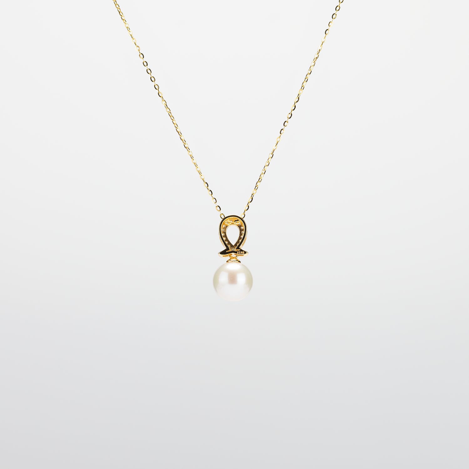 Pearl  pendant necklace on a white background