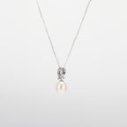 Pearl  pendant necklace on a white background