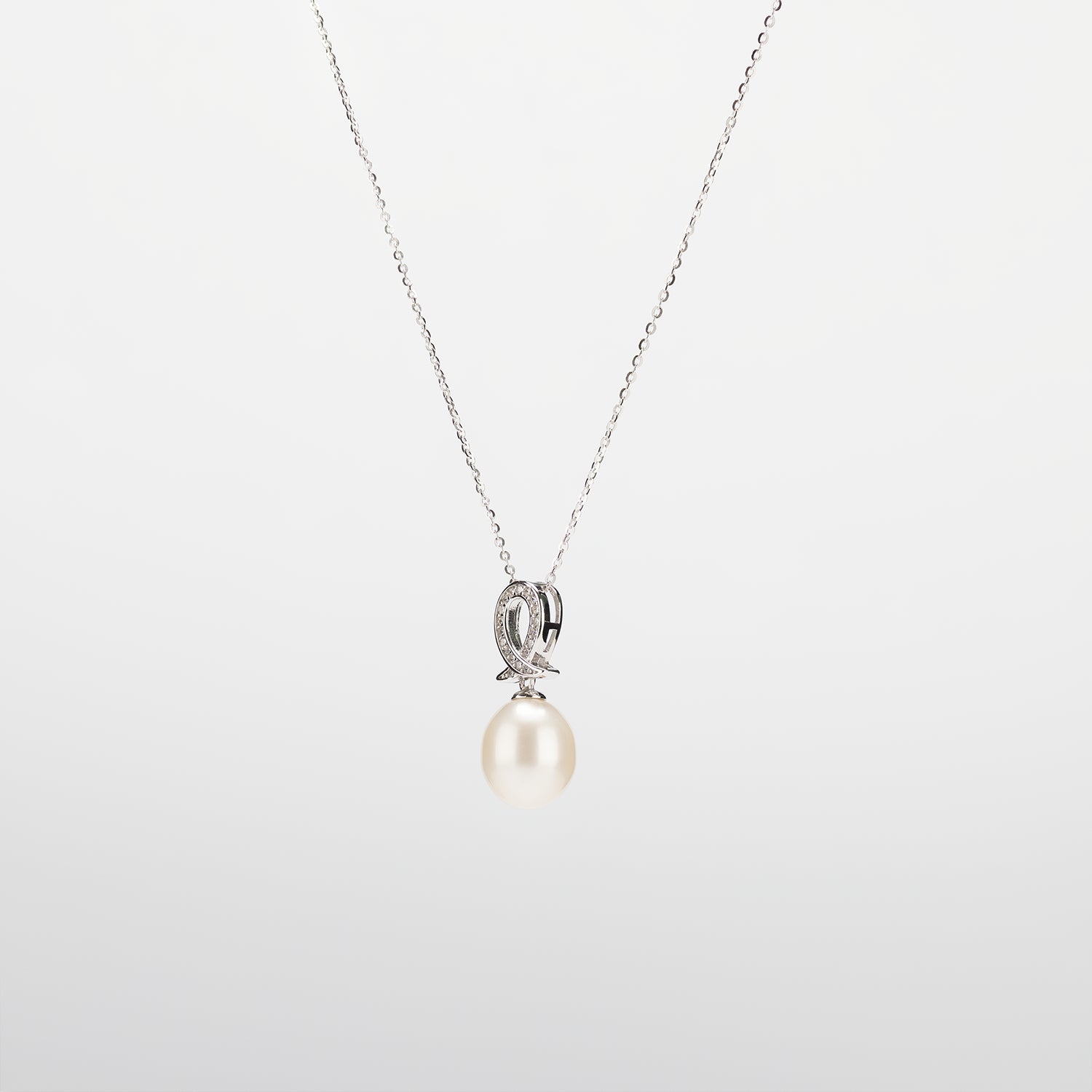 Pearl  pendant necklace on a white background