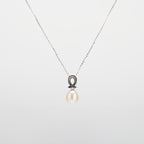 Pearl  pendant necklace on a white background