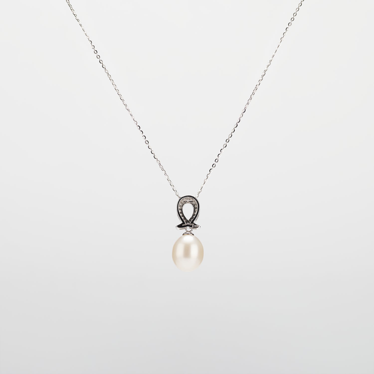 Pearl  pendant necklace on a white background