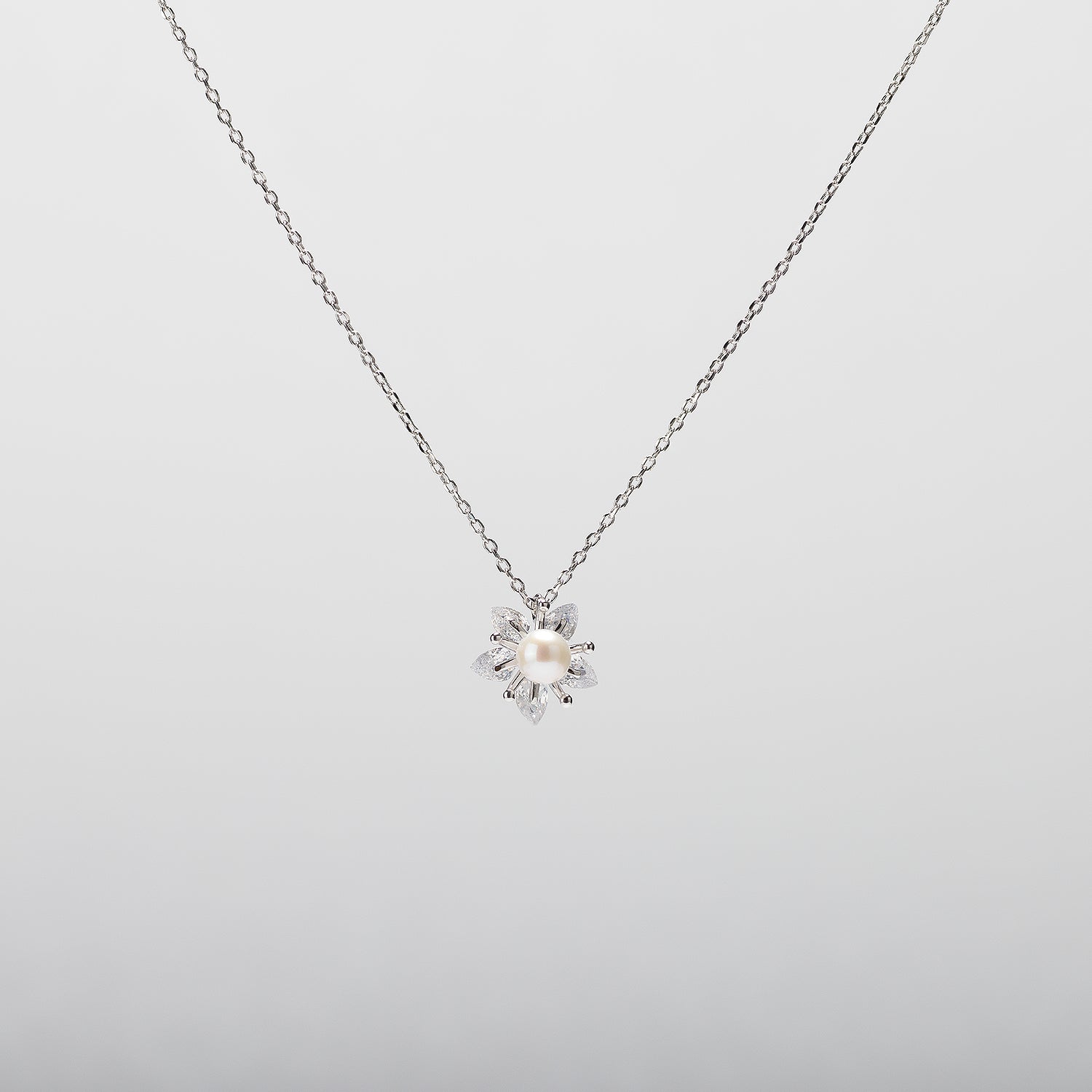 Pearl  pendant necklace on a white background