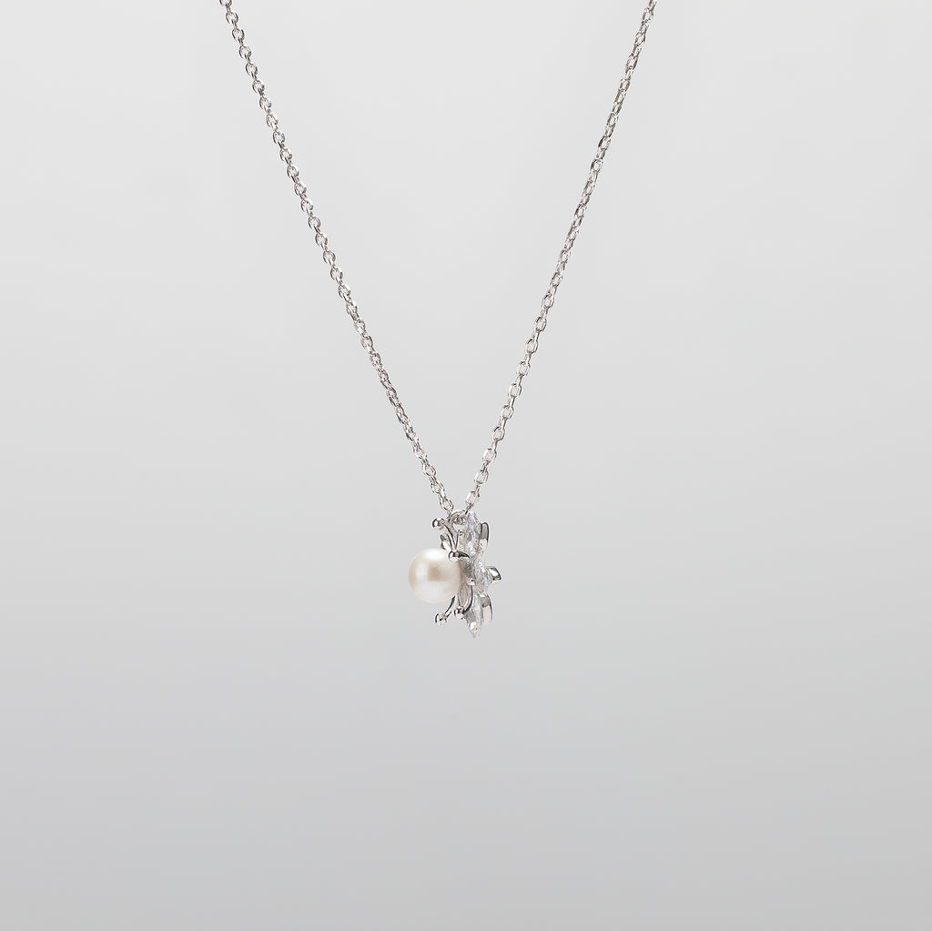 Pearl  pendant necklace on a white background