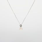 Pearl  pendant necklace on a white background