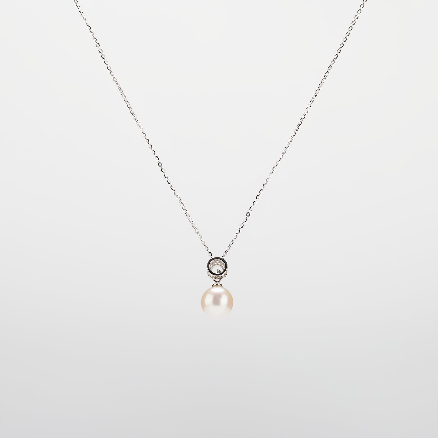 Pearl  pendant necklace on a white background