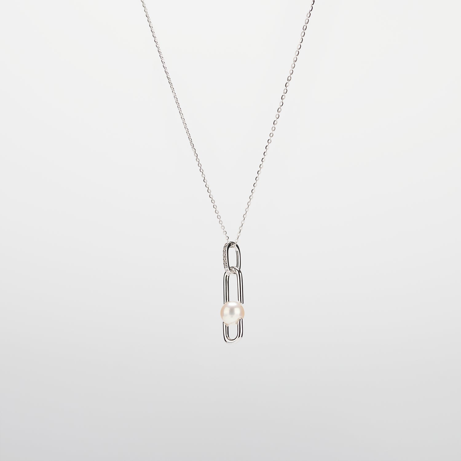 Pearl  pendant necklace on a white background