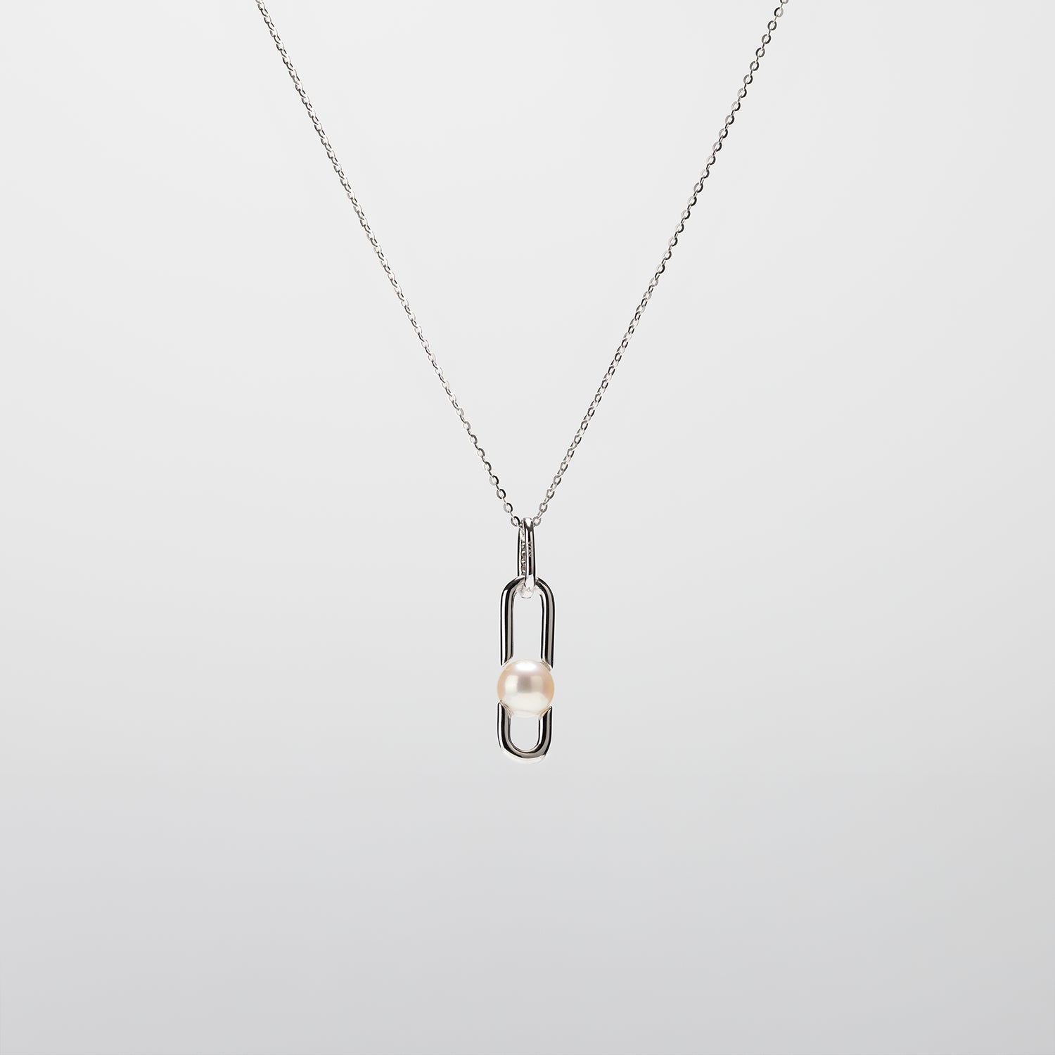 Pearl  pendant necklace on a white background