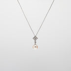 Pearl  pendant necklace on a white background
