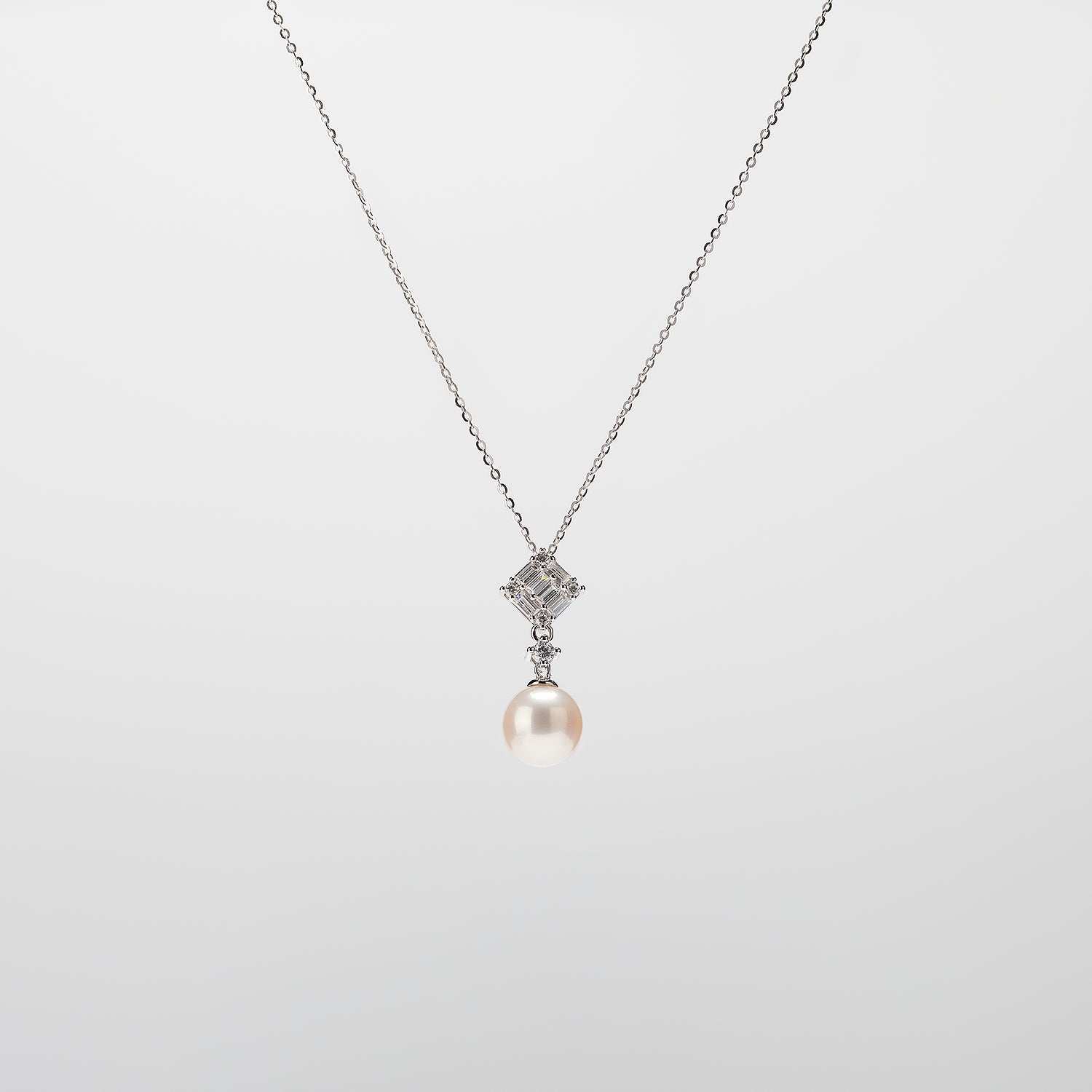 Pearl  pendant necklace on a white background
