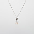 Pearl  pendant necklace on a white background
