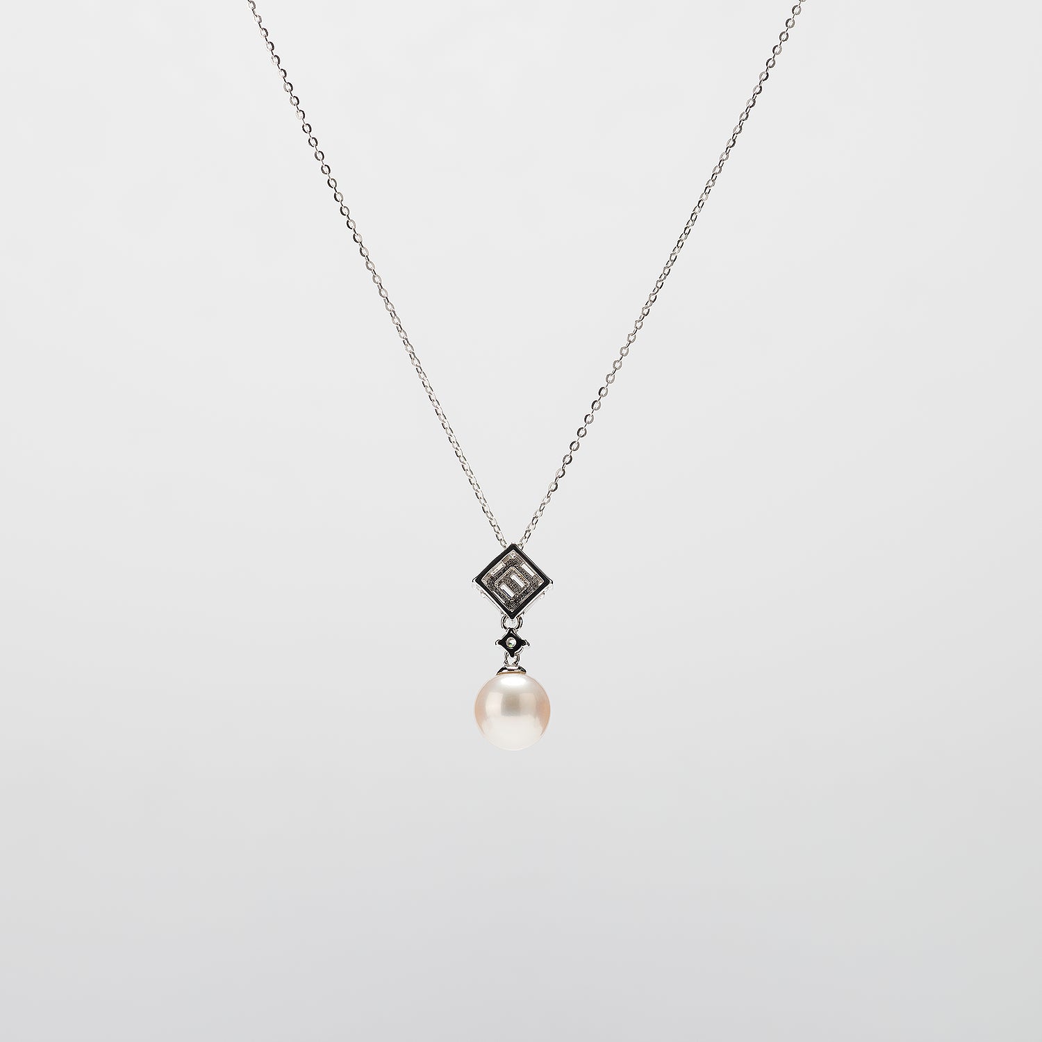 Pearl  pendant necklace on a white background