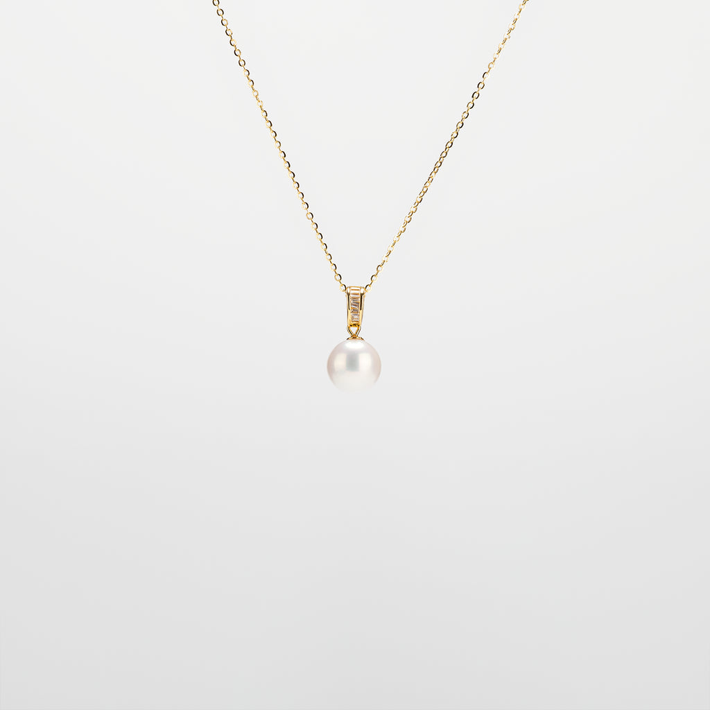 Pearl Drop Necklace with gold chain on a light gray background