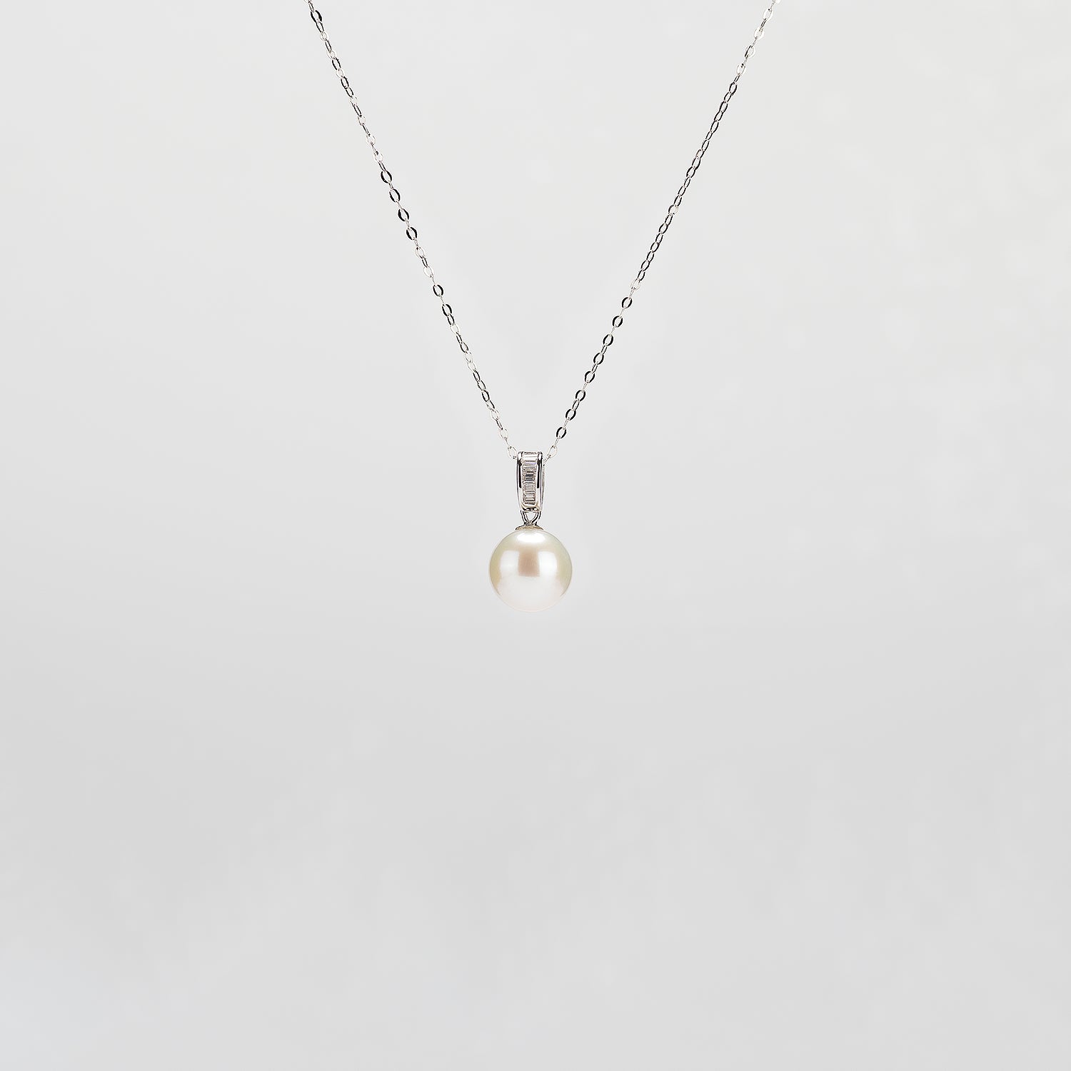 Pearl  pendant necklace on a white background