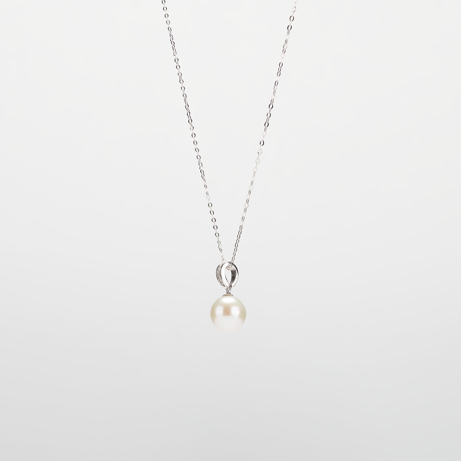 Pearl  pendant necklace on a white background