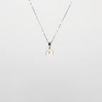 Pearl  pendant necklace on a white background