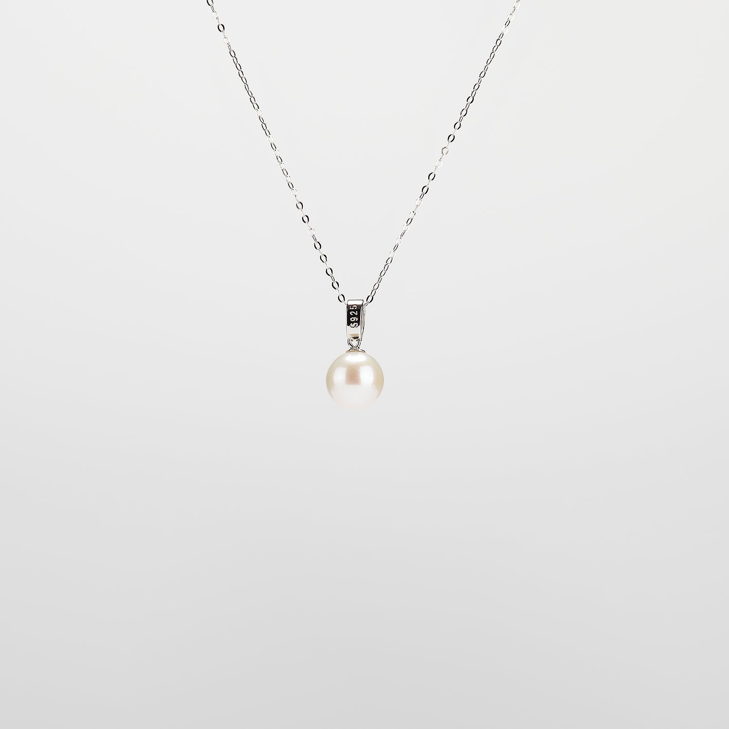 Pearl  pendant necklace on a white background