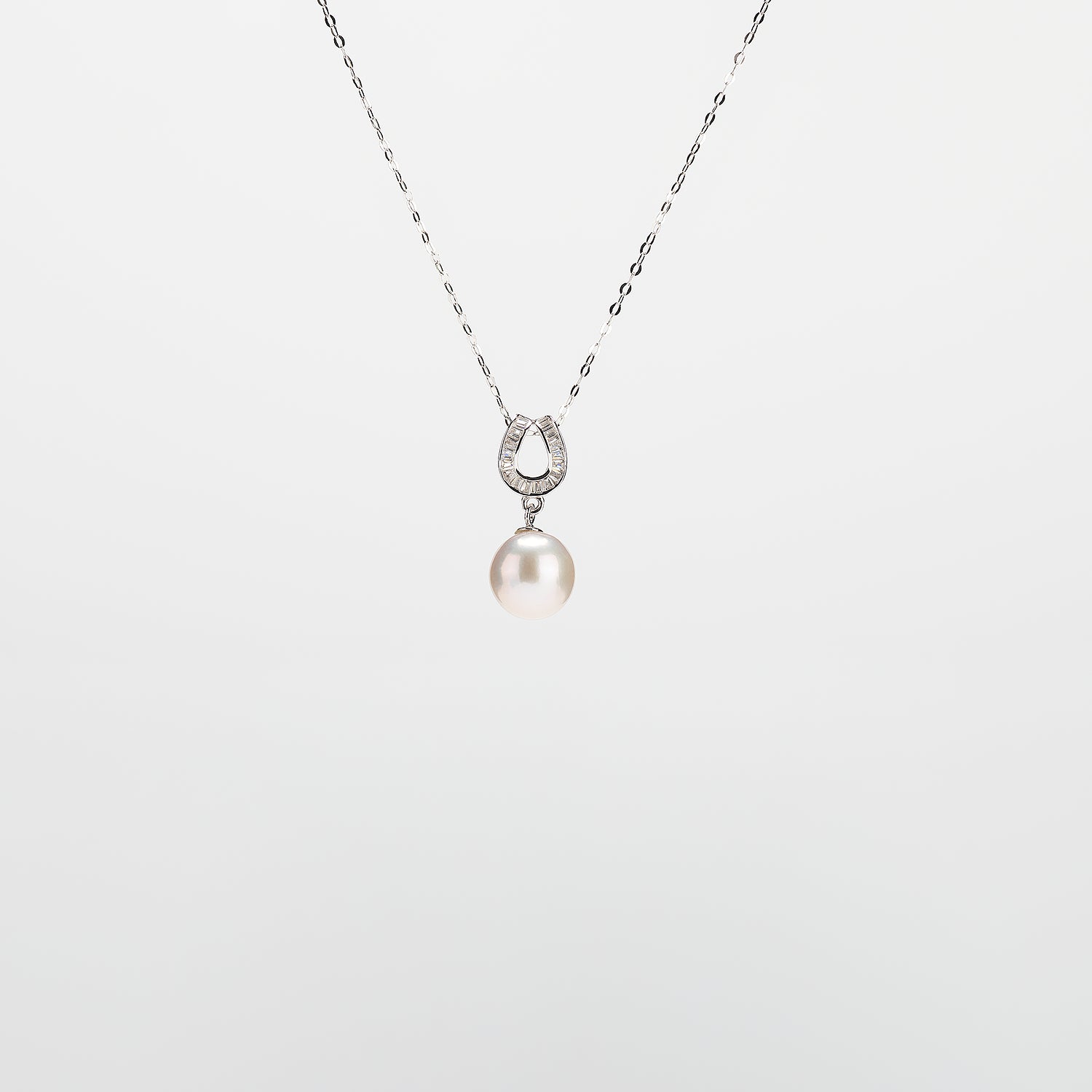Pearl  pendant necklace on a white background
