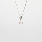 Pearl  pendant necklace on a white background