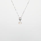 Pearl  pendant necklace on a white background