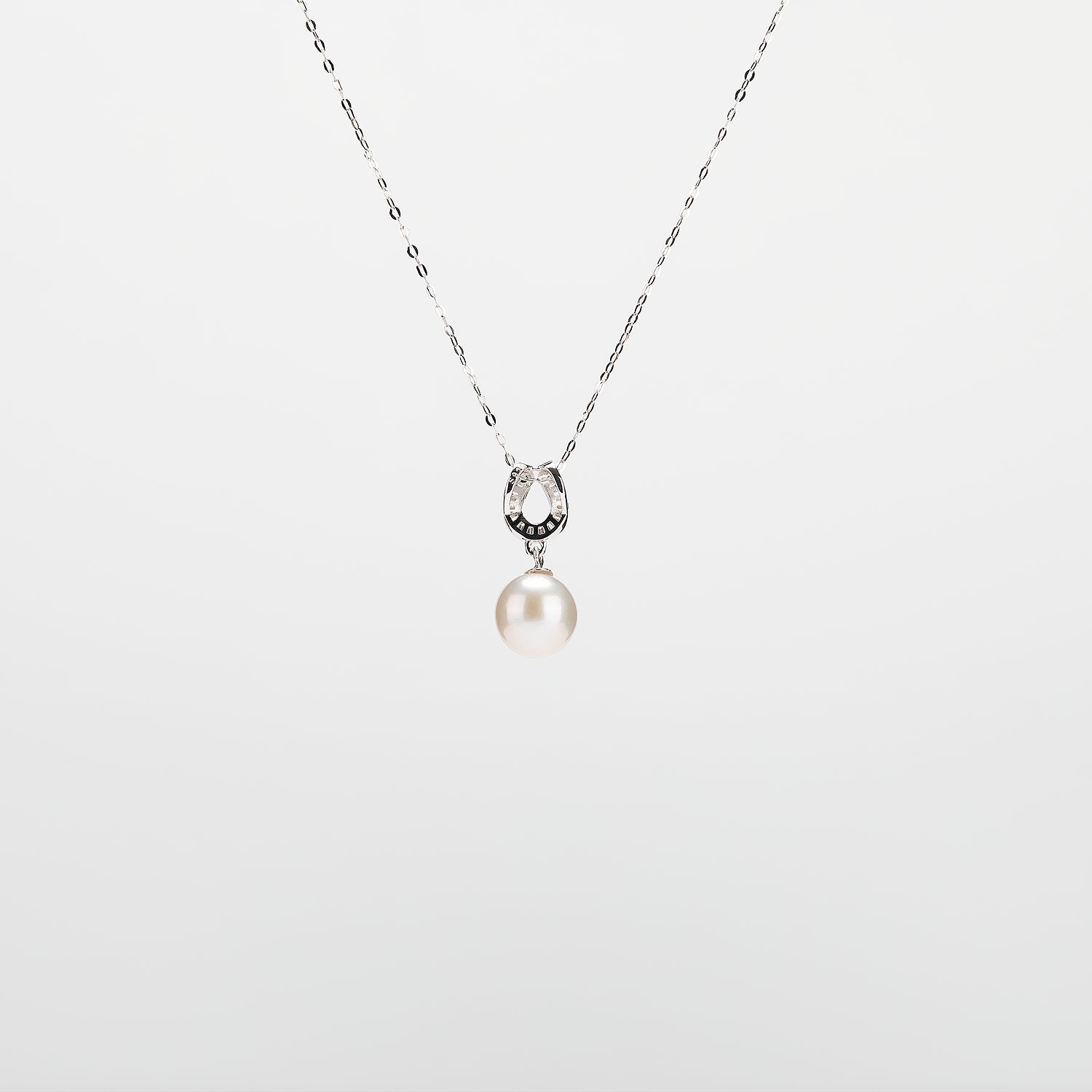 Pearl  pendant necklace on a white background