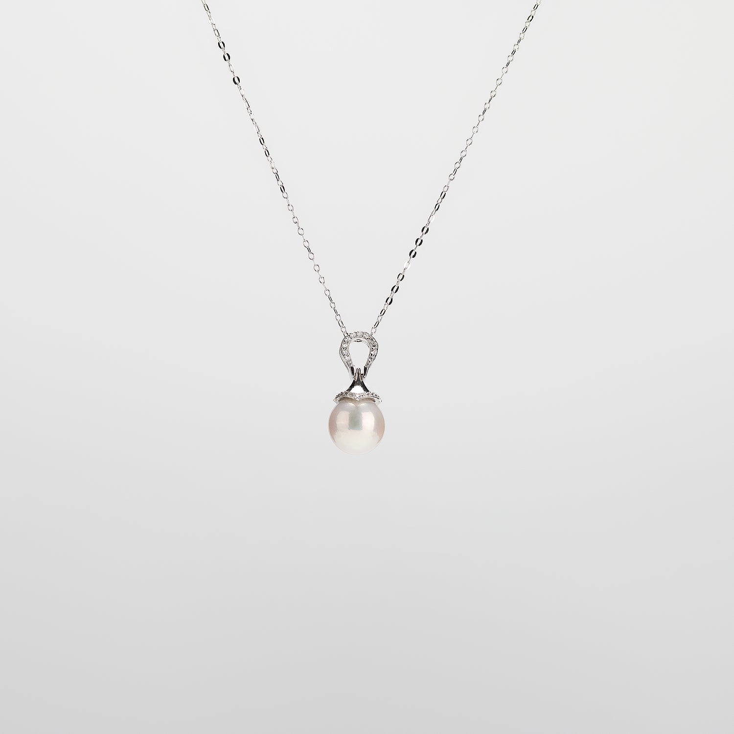 Pearl  pendant necklace on a white background