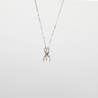 Pearl  pendant necklace on a white background