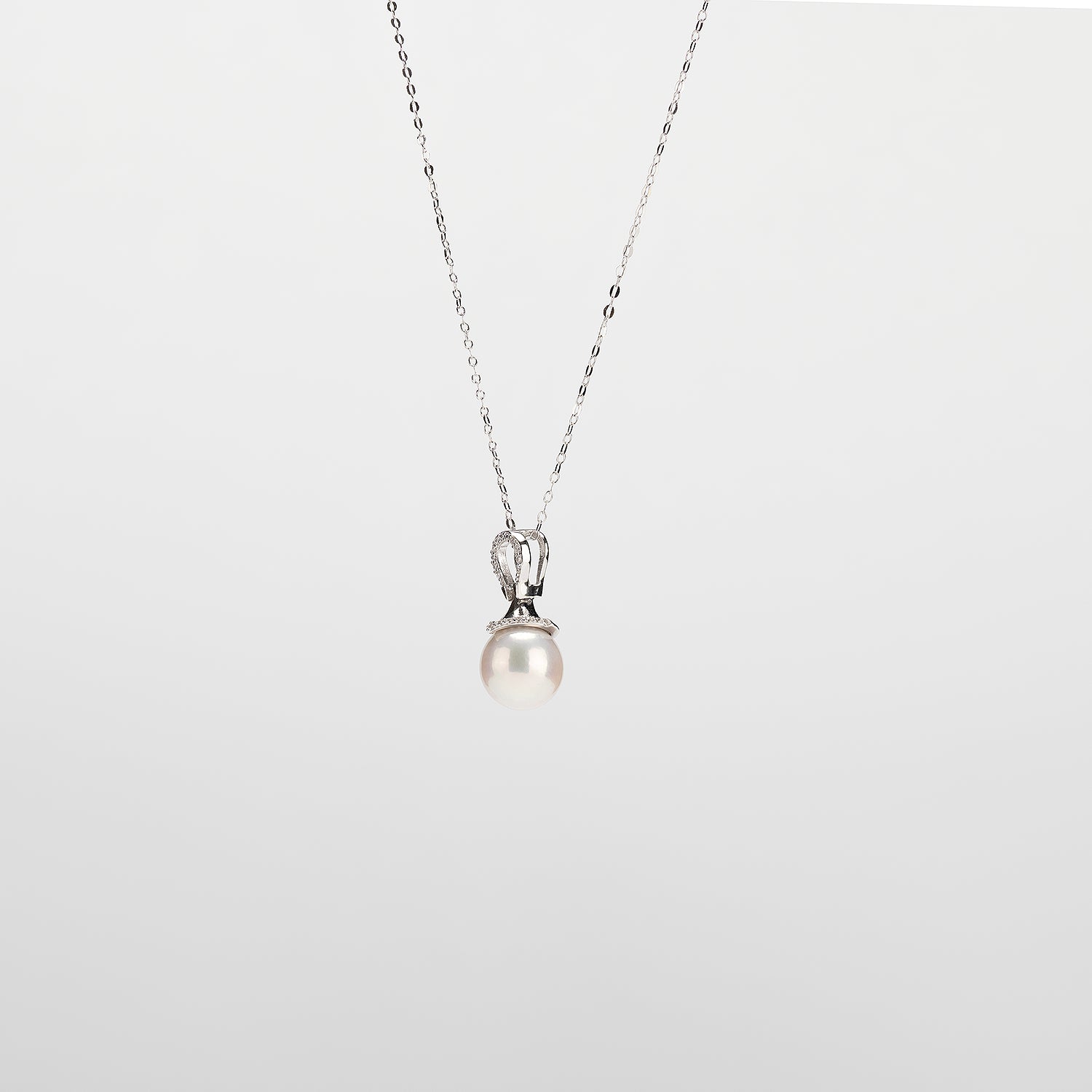Pearl  pendant necklace on a white background