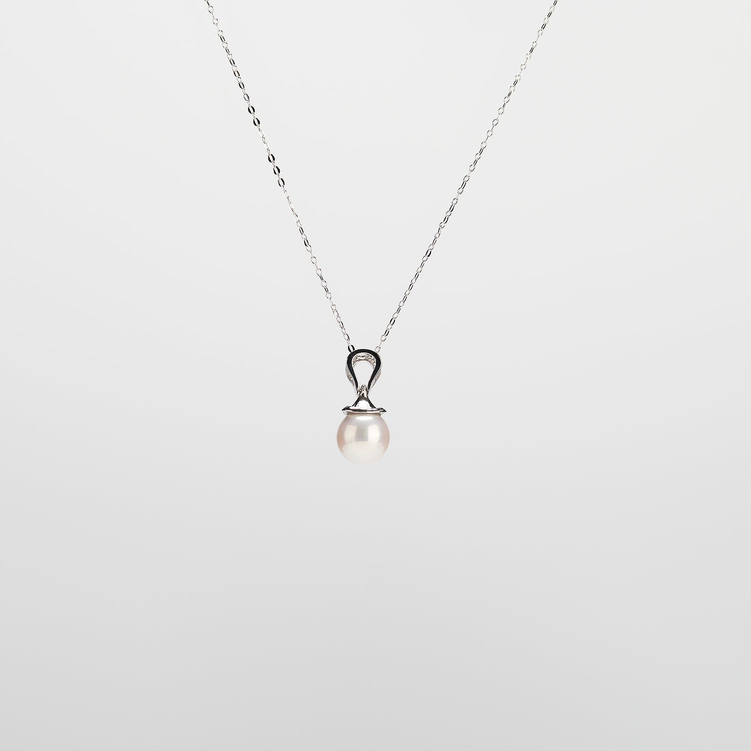 Pearl  pendant necklace on a white background